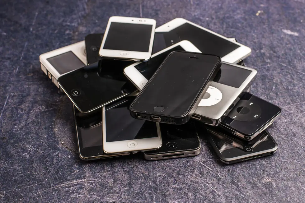 Pile of old smartphones and music players