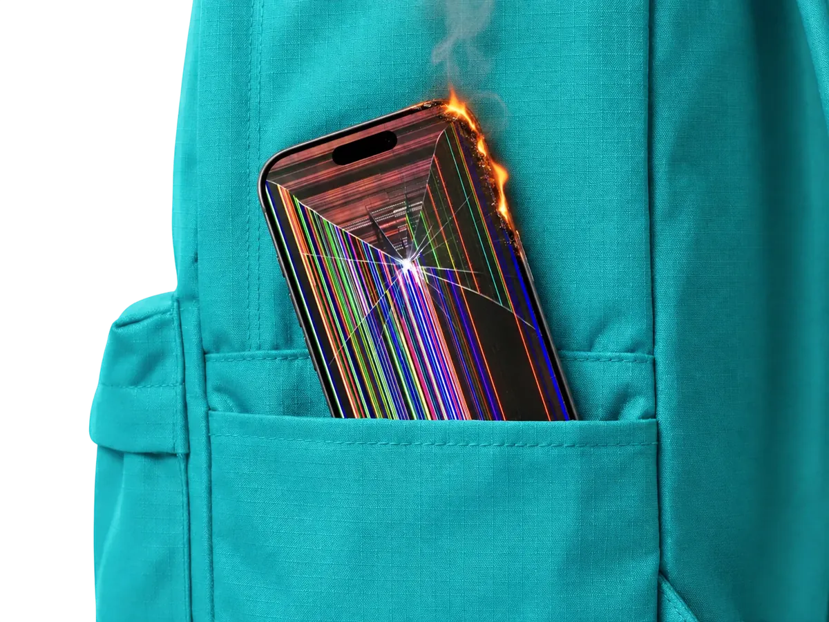 Phone with a shattered screen in a backpack pocket